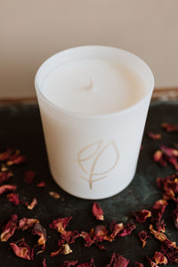 White filled candle and glassware with etched EPT logo 