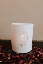 White candle glassware with etched EPT logo and tealight