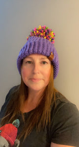 Hand-knitted purple bobble hat